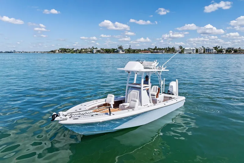 Slide: The Image of 2021 Barker Boatworks 26 Open on calm blue water under a clear sky. - 6
