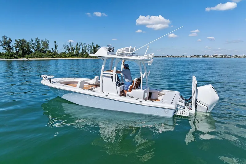 Slide: The Image of 2021 Barker Boatworks 26 Open cruising on clear blue water under a sunny sky. - 7