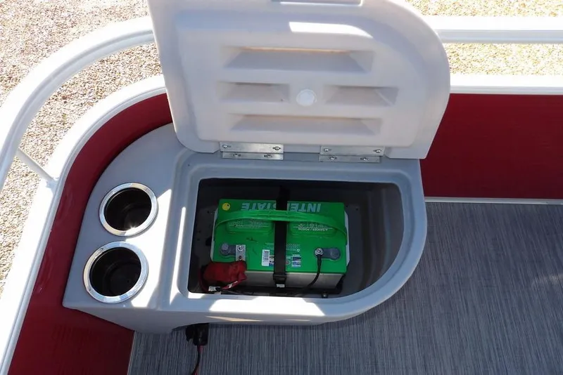Slide: The Image of Open storage compartment with battery in 2022 Bennington 20 SVF boat. - 14
