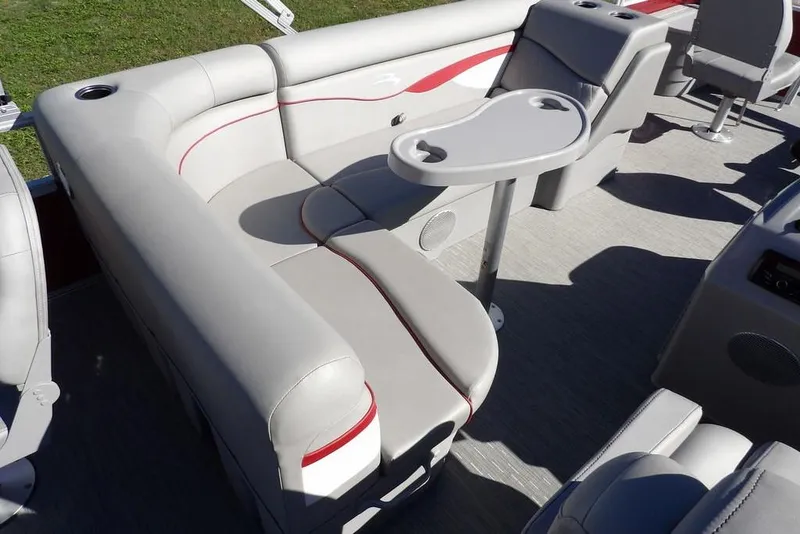 Slide: The Image of 2022 Bennington 20 SVF boat interior with gray seating and a small table. - 24