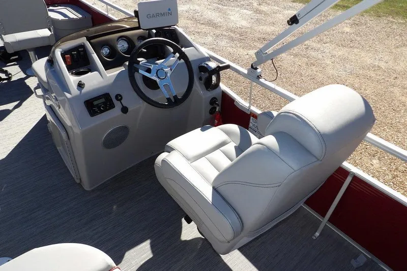 Slide: The Image of 2022 Bennington 20 SVF boat interior with steering wheel and Garmin navigation system. - 26
