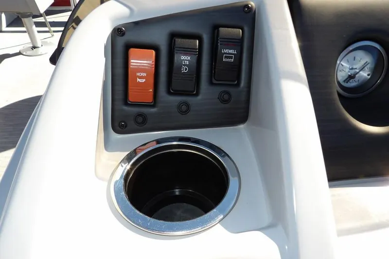 Slide: The Image of Control panel of 2022 Bennington 20 SVF boat with switches and cup holder. - 31