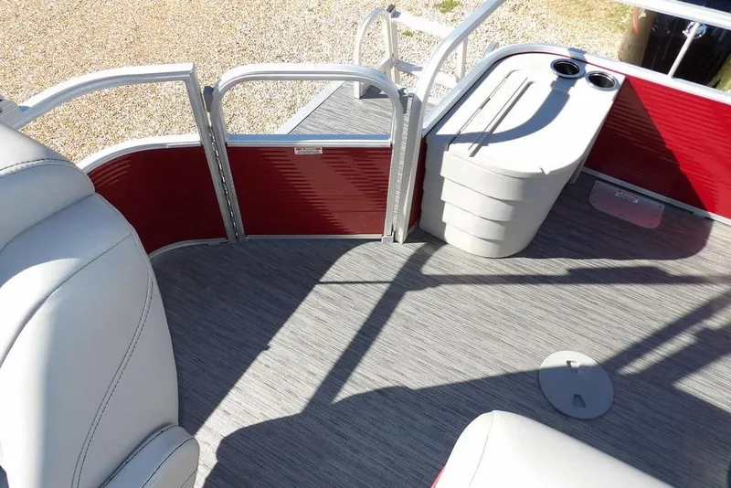Slide: The Image of Interior of 2022 Bennington 20 SVF pontoon boat with red paneling and seating. - 34