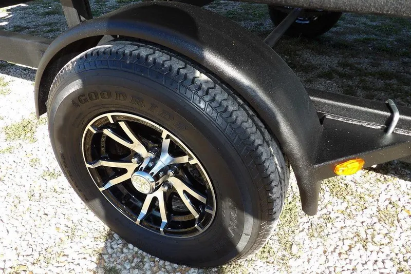 Slide: The Image of Trailer wheel of a 2022 Bennington 20 SVF, featuring Goodride tire and black alloy rim. - 40
