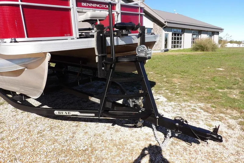 Slide: The Image of 2022 Bennington 20 SVF pontoon boat on trailer, parked outdoors near a building. - 41