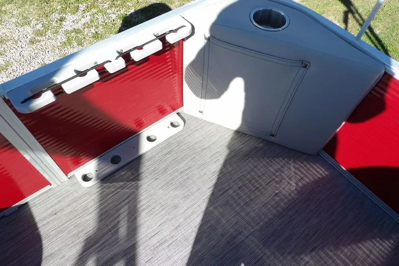 Slide: The Image of Interior of 2022 Bennington 20 SVF boat with red panels and cup holder. - 43
