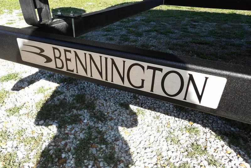 Slide: The Image of Bennington 20 SVF 2022 logo on boat trailer, gravel and grass background. - 44