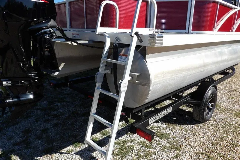 Slide: The Image of 2022 Bennington 20 SVF pontoon boat with ladder and trailer, rear view. - 48