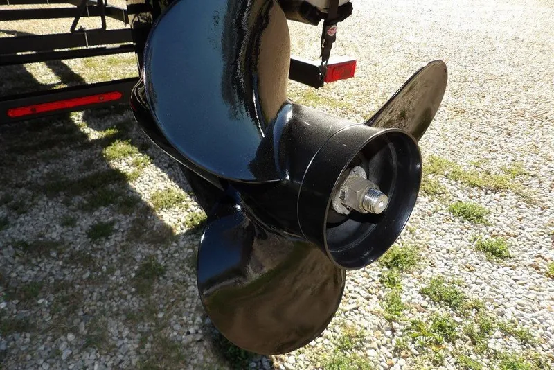 Slide: The Image of Close-up of a 2022 Bennington 20 SVF boat propeller on gravel surface. - 52