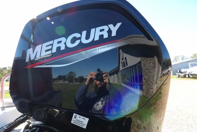 Slide: The Image of Mercury FourStroke engine on 2022 Bennington 20 SVF boat, reflecting surroundings. - 53