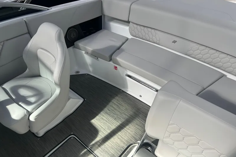 Slide: The Image of 2026 Four Winns H1 Freedom boat interior with sleek seating and modern design. - 14