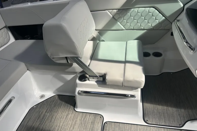 Slide: The Image of 2026 Four Winns H1 Freedom boat interior with modern seating and sleek design. - 18