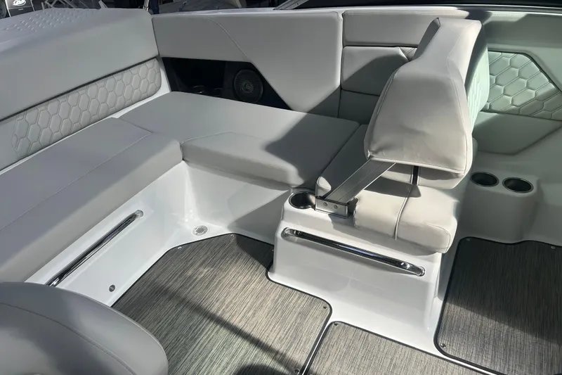 Slide: The Image of Luxurious interior of 2026 Four Winns H1 Freedom boat with sleek seating design. - 19
