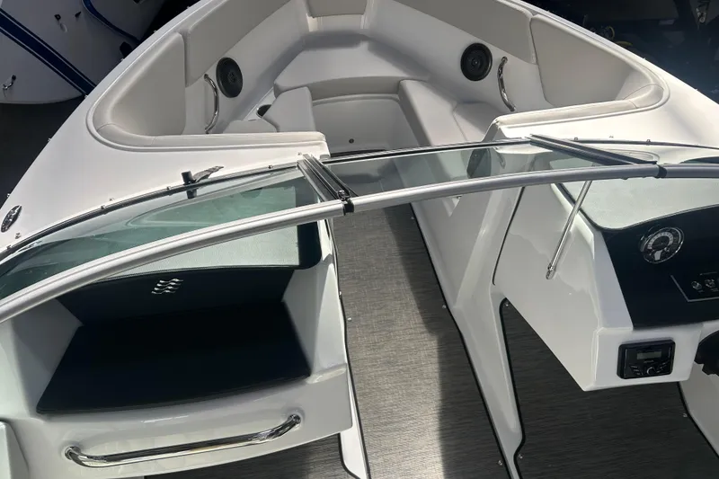 Slide: The Image of 2026 Four Winns H1 Freedom boat interior with sleek seating and modern dashboard. - 22