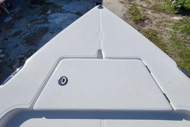Slide: The Image of Bow of 2026 Savannah 220 IS boat with textured deck surface. - 10