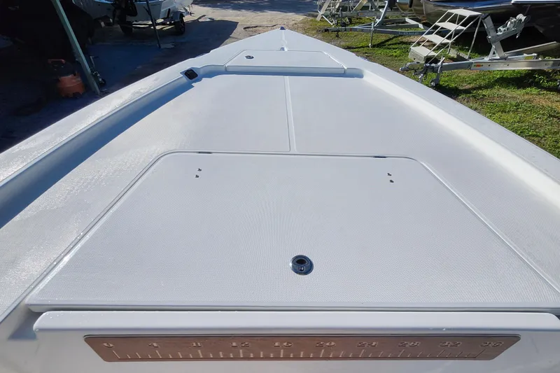 Slide: The Image of 2026 Savannah 220 IS boat deck, featuring sleek design and spacious layout. - 11