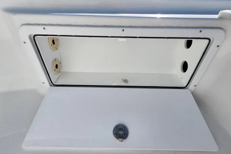 Slide: The Image of Open storage compartment on a 2026 Savannah 220 IS boat. - 16