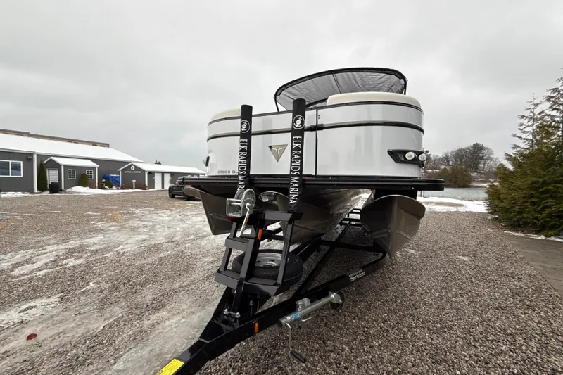 Slide: The Image of 2026 Tahoe Pontoon Cascade Quad Lounger Shift on trailer in snowy outdoor setting. - 11