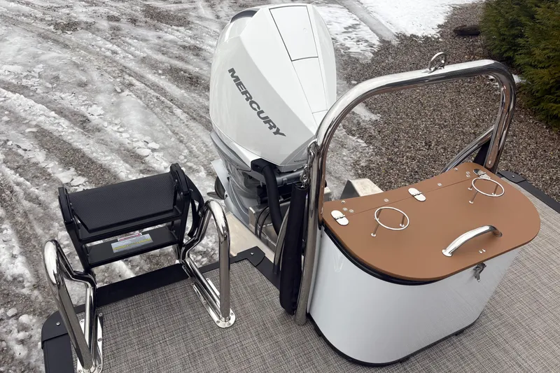 Slide: The Image of 2026 Tahoe Pontoon Cascade Quad Lounger Shift with Mercury engine, snowy background. - 12