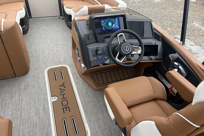 Slide: The Image of 2026 Tahoe Pontoon Cascade Quad Lounger Shift interior with modern dashboard and tan seating. - 15