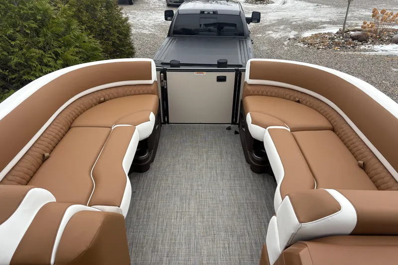 Slide: The Image of 2026 Tahoe Pontoon Cascade Quad Lounger Shift with luxurious brown seating and spacious layout. - 17