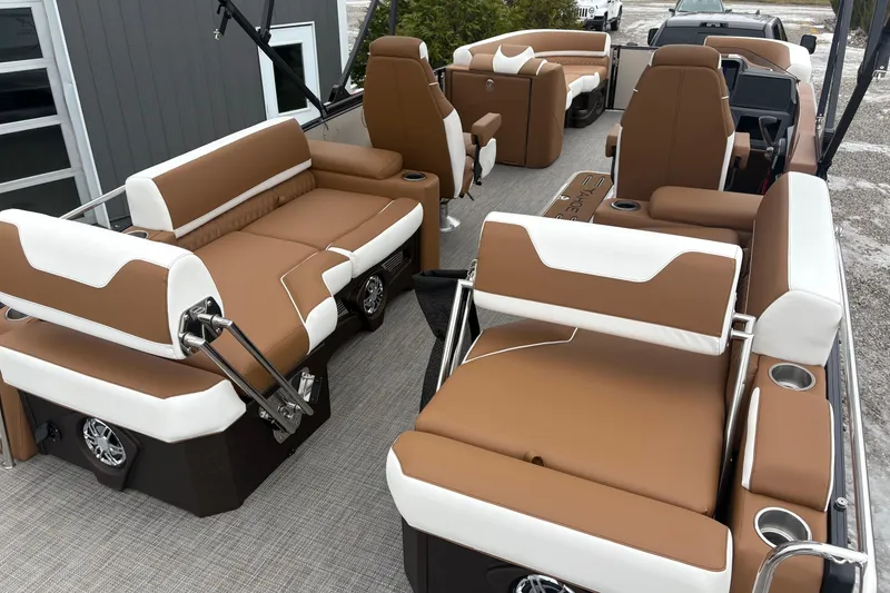 Slide: The Image of 2026 Tahoe Pontoon Cascade Quad Lounger Shift with luxurious brown and white seating. - 19