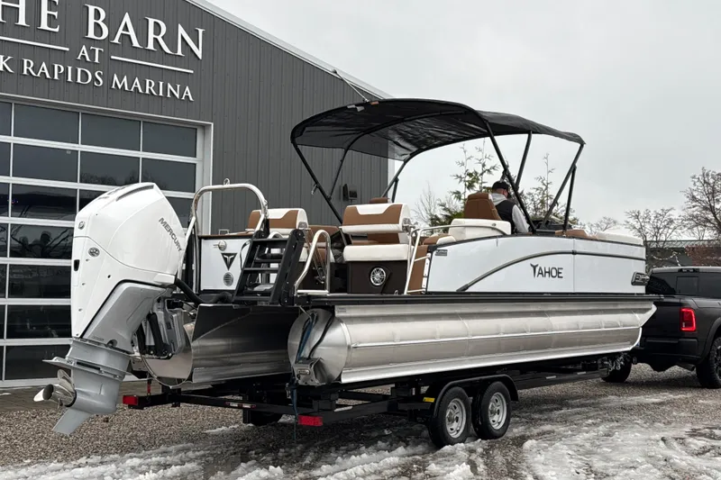 Slide: The Image of 2026 Tahoe Pontoon Cascade Quad Lounger Shift at marina, featuring sleek design and powerful engine. - 6