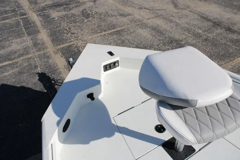 Slide: The Image of 2025 Excel Bay Pro Elite 230 boat with cushioned seat on deck. - 14