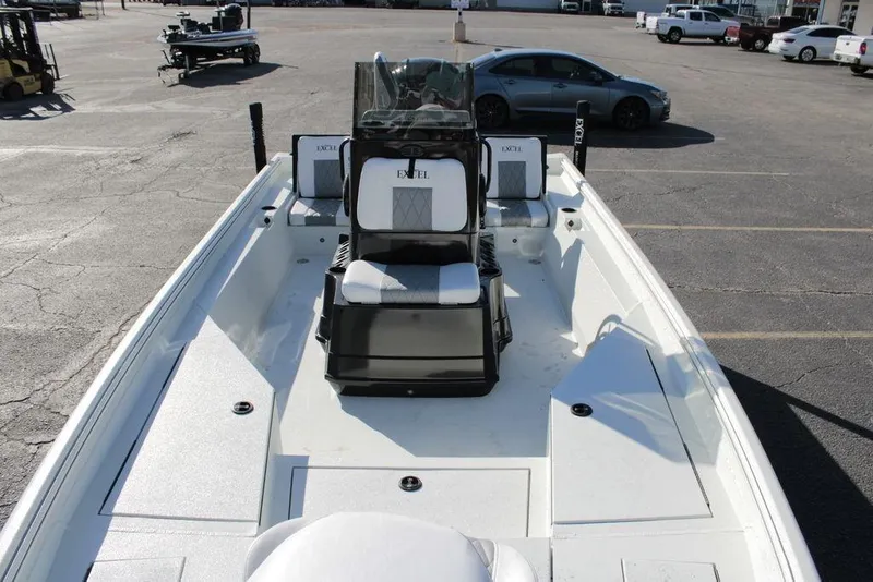 Slide: The Image of 2025 Excel Bay Pro Elite 230 boat, white interior, parked in a lot. - 15
