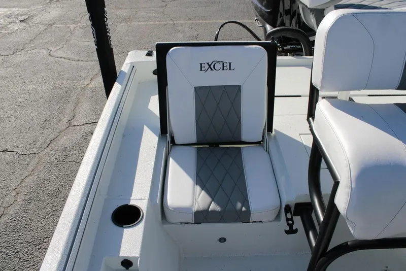 Slide: The Image of 2025 Excel Bay Pro Elite 230 boat seat with white and gray upholstery. - 17