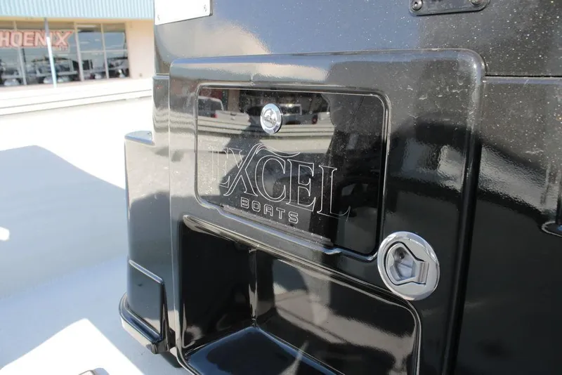 Slide: The Image of 2025 Excel Bay Pro Elite 230 boat, black exterior with logo detail. - 20