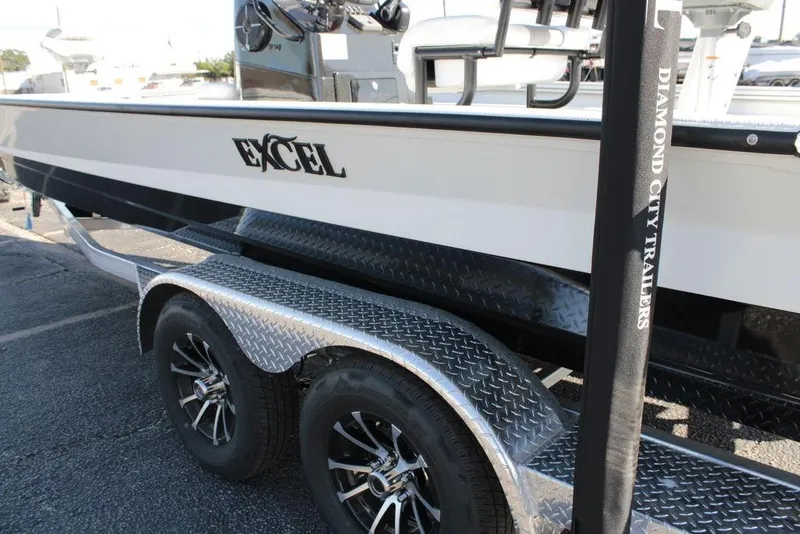 Slide: The Image of 2025 Excel Bay Pro Elite 230 boat on a Diamond City trailer. - 22