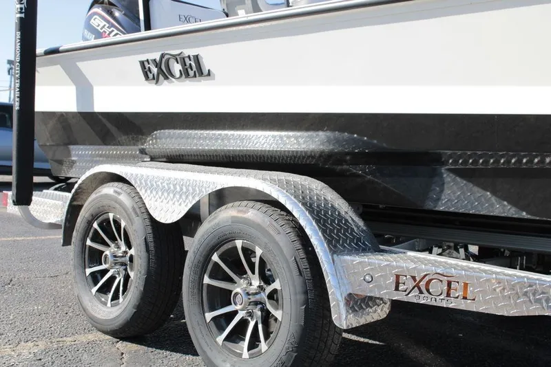 Slide: The Image of 2025 Excel Bay Pro Elite 230 boat on a trailer with alloy wheels. - 3
