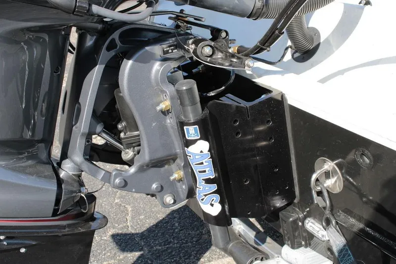 Slide: The Image of Close-up of 2025 Excel Bay Pro Elite 230 boat motor mount and hydraulic system. - 4