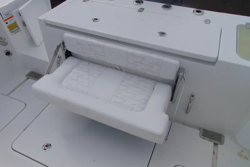 Slide: The Image of Foldable seat on 2026 Parker 247 Explorer boat, featuring white cushioned design. - 11