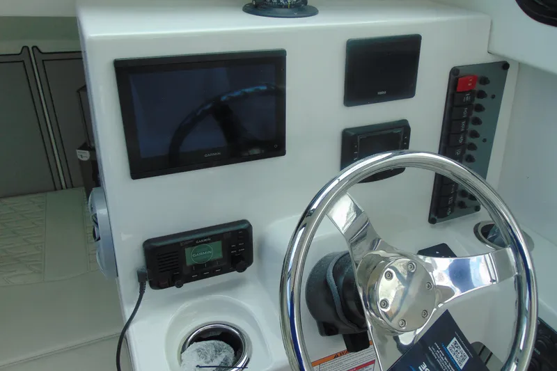 Slide: The Image of Steering console of 2026 Parker 247 Explorer with Garmin navigation system. - 20