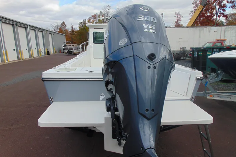 Slide: The Image of 2026 Parker 247 Explorer boat with powerful 300 V6 engine, docked outdoors. - 4