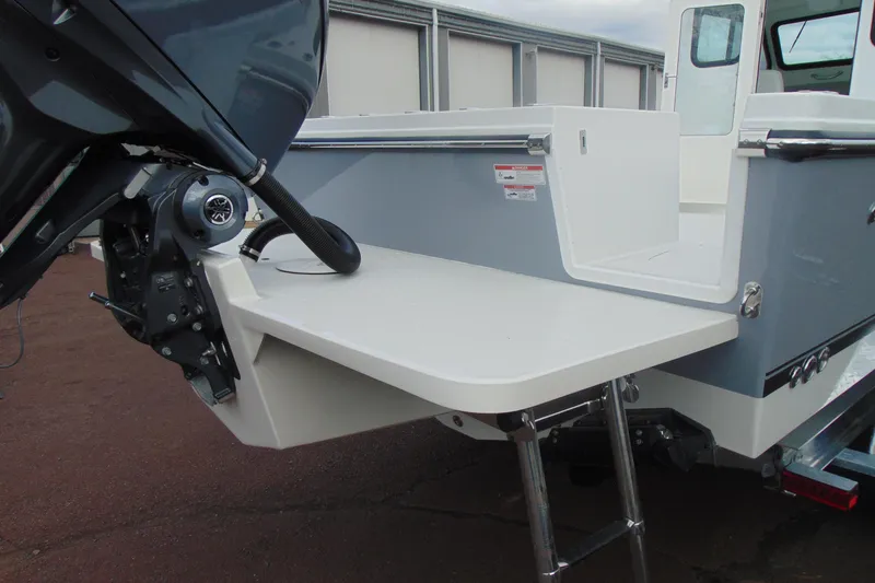 Slide: The Image of 2026 Parker 247 Explorer boat with outboard motor and swim platform. - 5