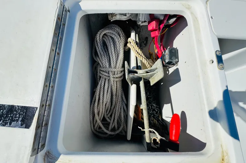 Slide: The Image of Storage compartment on 2000 Mainship 390 Trawler with rope, anchor, and equipment. - 20