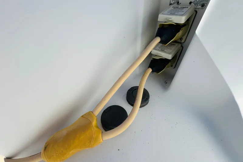 Slide: The Image of Power cables connected on a 2000 Mainship 390 Trawler boat. - 21