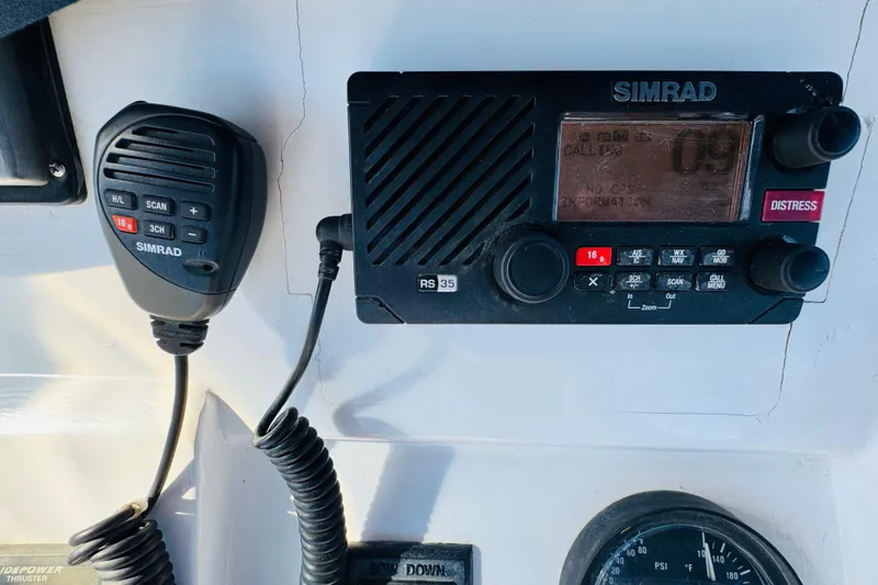 Slide: The Image of Simrad marine radio system on 2000 Mainship 390 Trawler dashboard. - 35