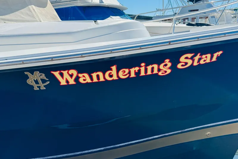 Slide: The Image of Blue Mainship 390 Trawler boat, "Wandering Star," 2000 model, docked in marina. - 5