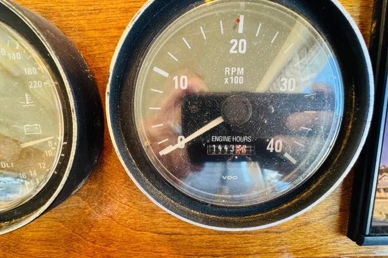 Slide: The Image of Close-up of Mainship 390 Trawler 2000 engine hour meter showing 1443.8 hours. - 59