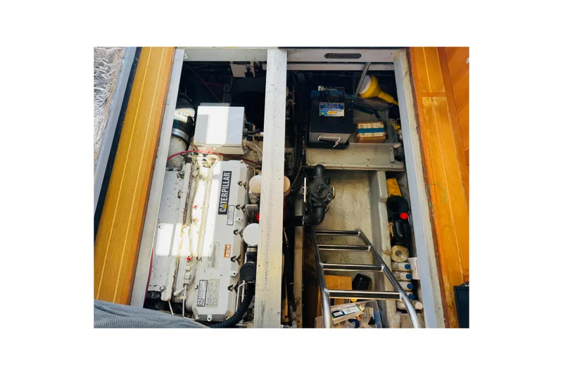 Slide: The Image of Engine compartment of 2000 Mainship 390 Trawler with Caterpillar engine and equipment. - 71