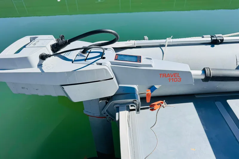 Slide: The Image of Electric outboard motor on Mainship 390 Trawler, 2000 model, near calm water. - 80