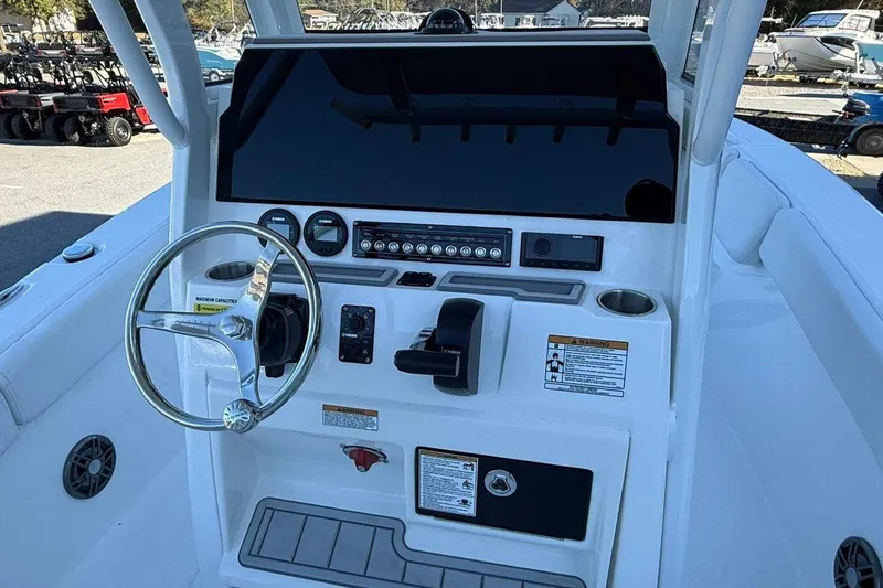 Slide: The Image of 2026 Sea Fox 228 Commander boat dashboard with steering wheel and controls. - 11