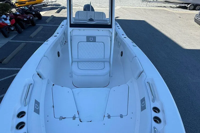 Slide: The Image of 2026 Sea Fox 228 Commander boat interior with white seating and storage compartments. - 13
