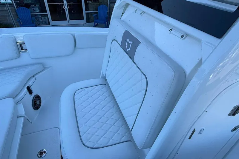 Slide: The Image of 2026 Sea Fox 228 Commander boat interior with white cushioned seating. - 17