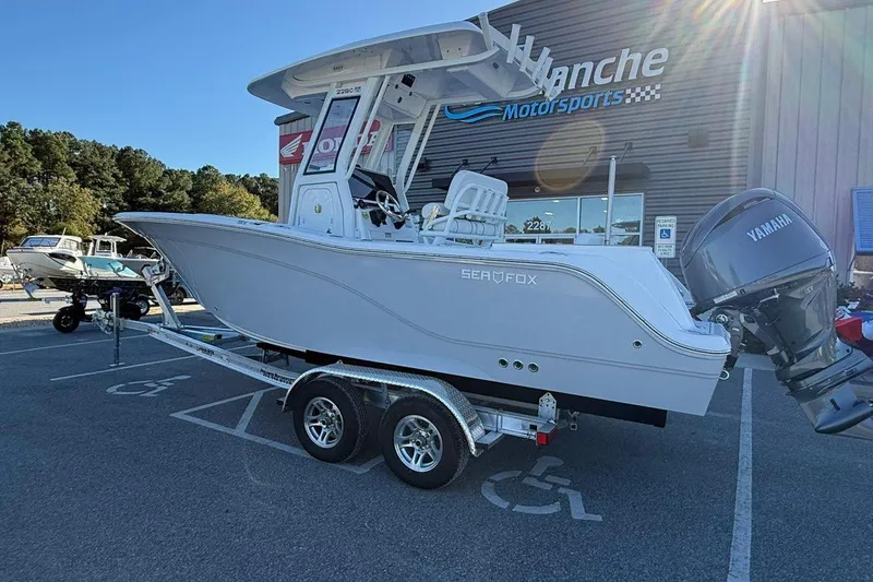 Slide: The Image of 2026 Sea Fox 228 Commander boat on trailer at dealership, featuring Yamaha outboard motor. - 4
