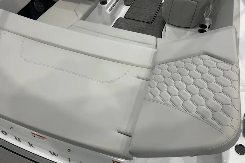 Slide: The Image of 2026 Four Winns H1 Freedom boat interior with sleek, modern seating design. - 11